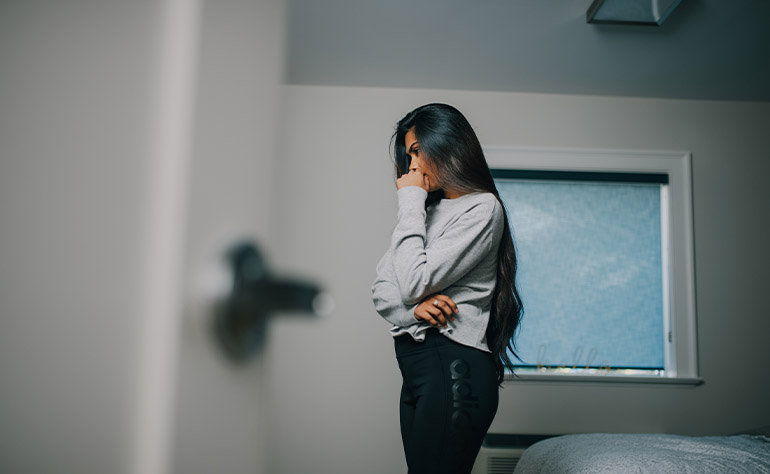 Woman individual in her area coping with depression symptoms.